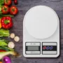 digital kitchen scale 10kg displaying precise ingredient measurements on an LCD screen.