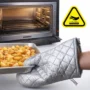 Heat resistant oven gloves with pad set holding a hot baking tray.