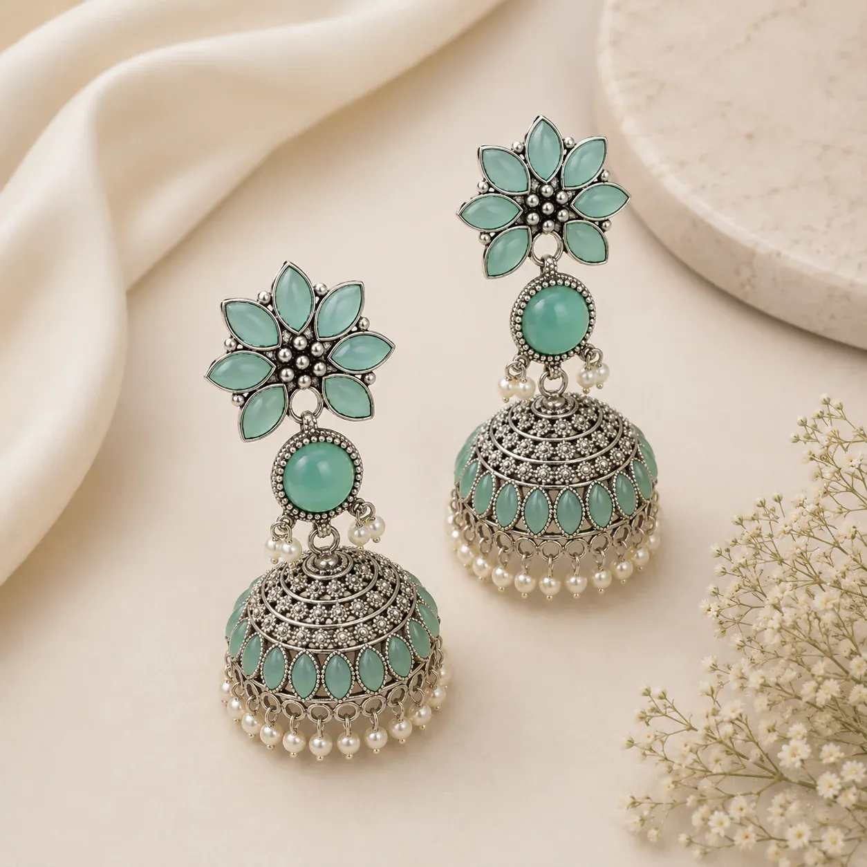 Elegant Oxidized Silver Jhumka Earrings with Sky Blue Stones & Pearl Accents - Detailed Feature View 1