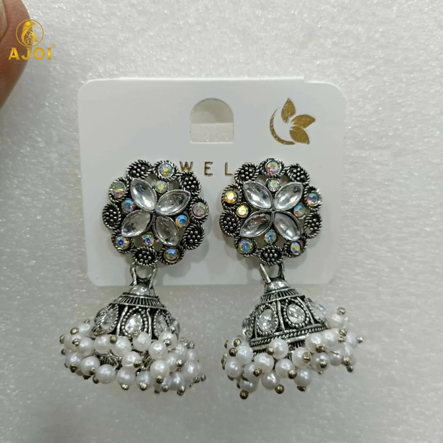 Silver Oxidized Floral Jhumka Earrings with Pearl Drops - Detailed Feature View 5