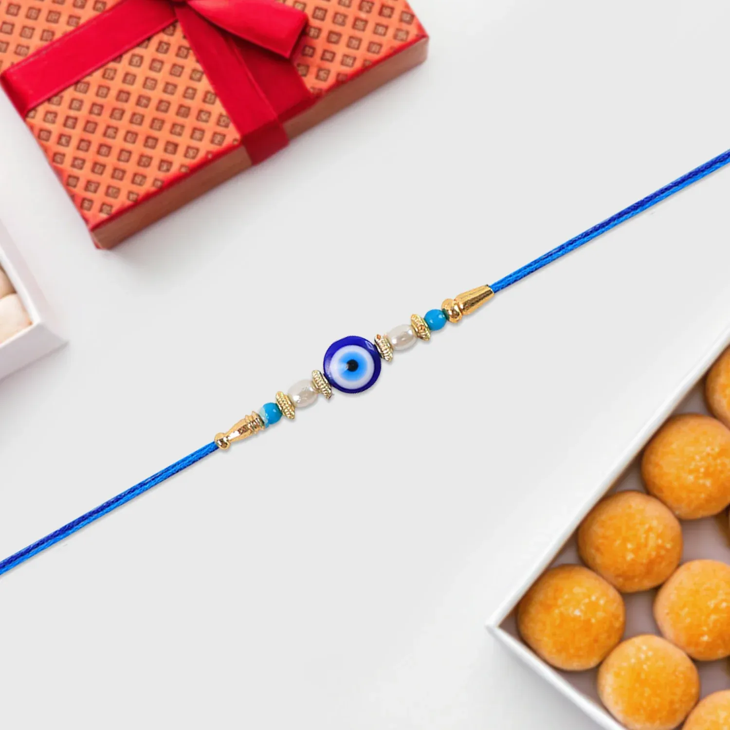 Blue Rakhi – Elegant Stone & Pearl Design for Brother - Detailed Feature View 2