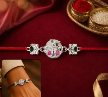 Silver Shrinathji Rakhi – Elegant Design with Pink & Green Stones