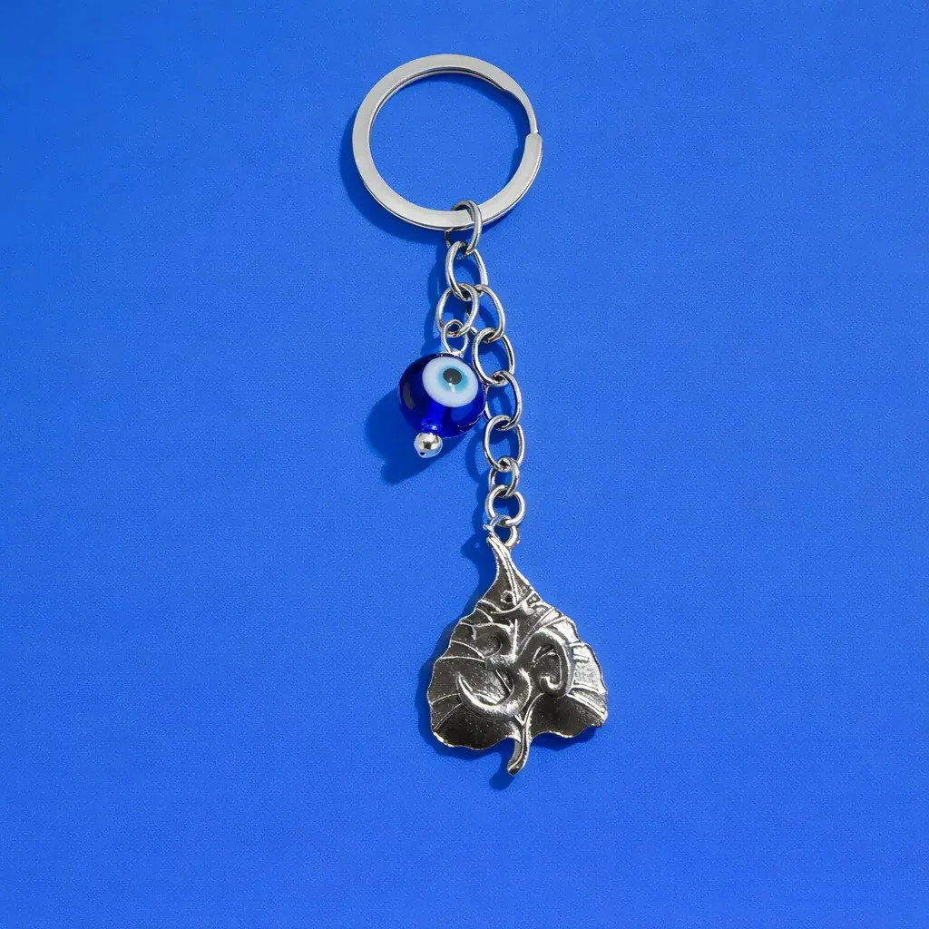 Premium Om Leaf Evil Eye Keychain – Spiritual Protection Charm for Positivity - Buy Online at Alikart