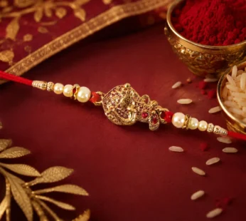 Golden Peacock Rakhi – Pearl Beads & Red Thread for Brother on Raksha Bandhan