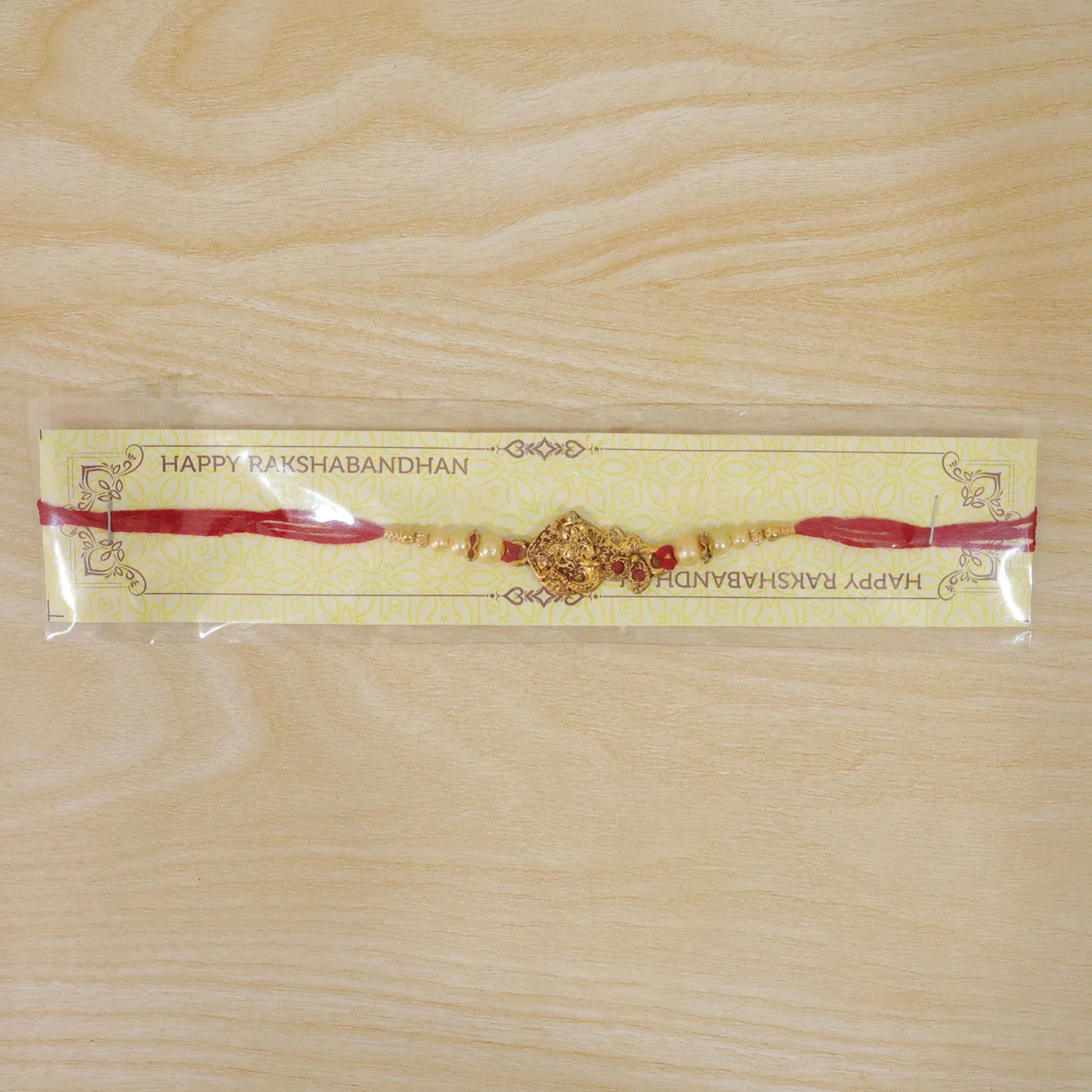 Golden Peacock Rakhi – Pearl Beads & Red Thread for Brother on Raksha Bandhan - Detailed Feature View 5
