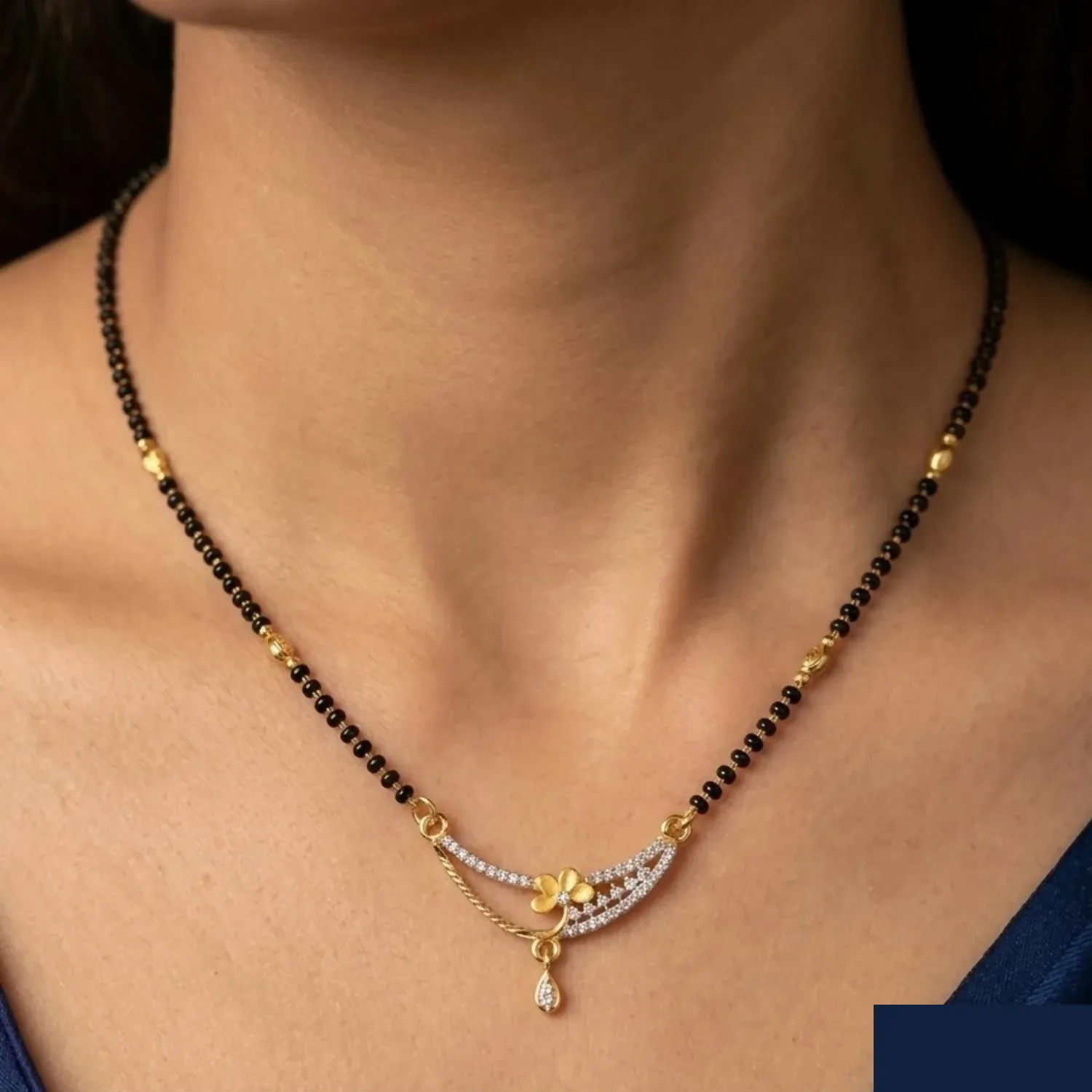 Gold and Diamond Floral Curved Mangalsutra with Single Black Bead Chain