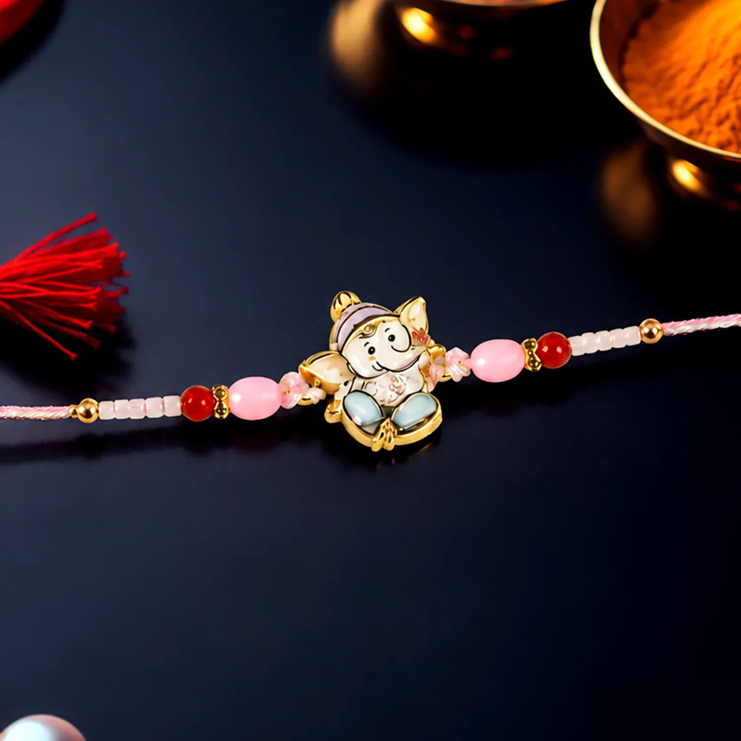 Premium Ganesha Rakhi – Beautiful Pink and Red Beads for Raksha Bandhan - Buy Online at Alikart