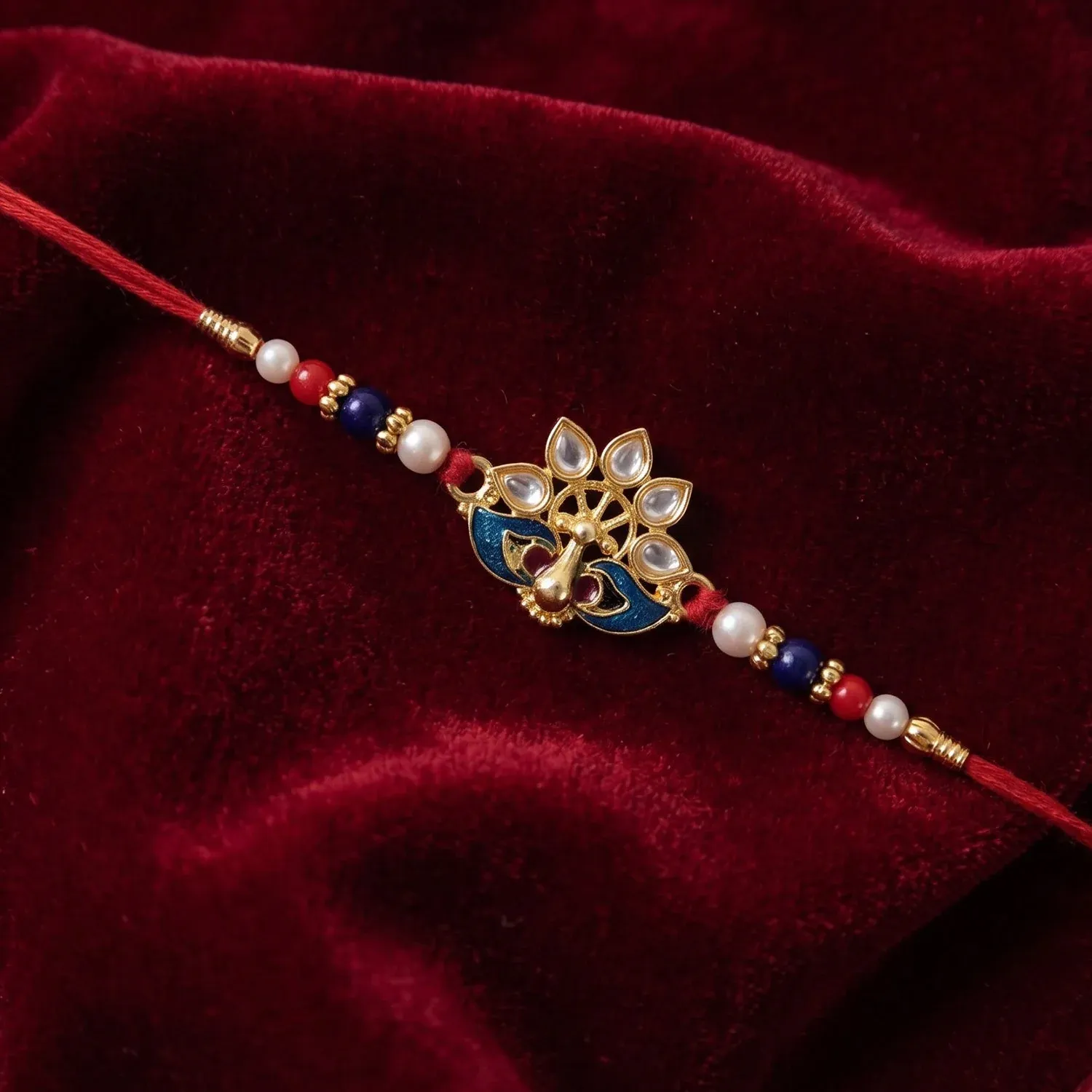 Peacock Rakhi – Elegant Pearl Beads & Bright Red Thread - Detailed Feature View 3