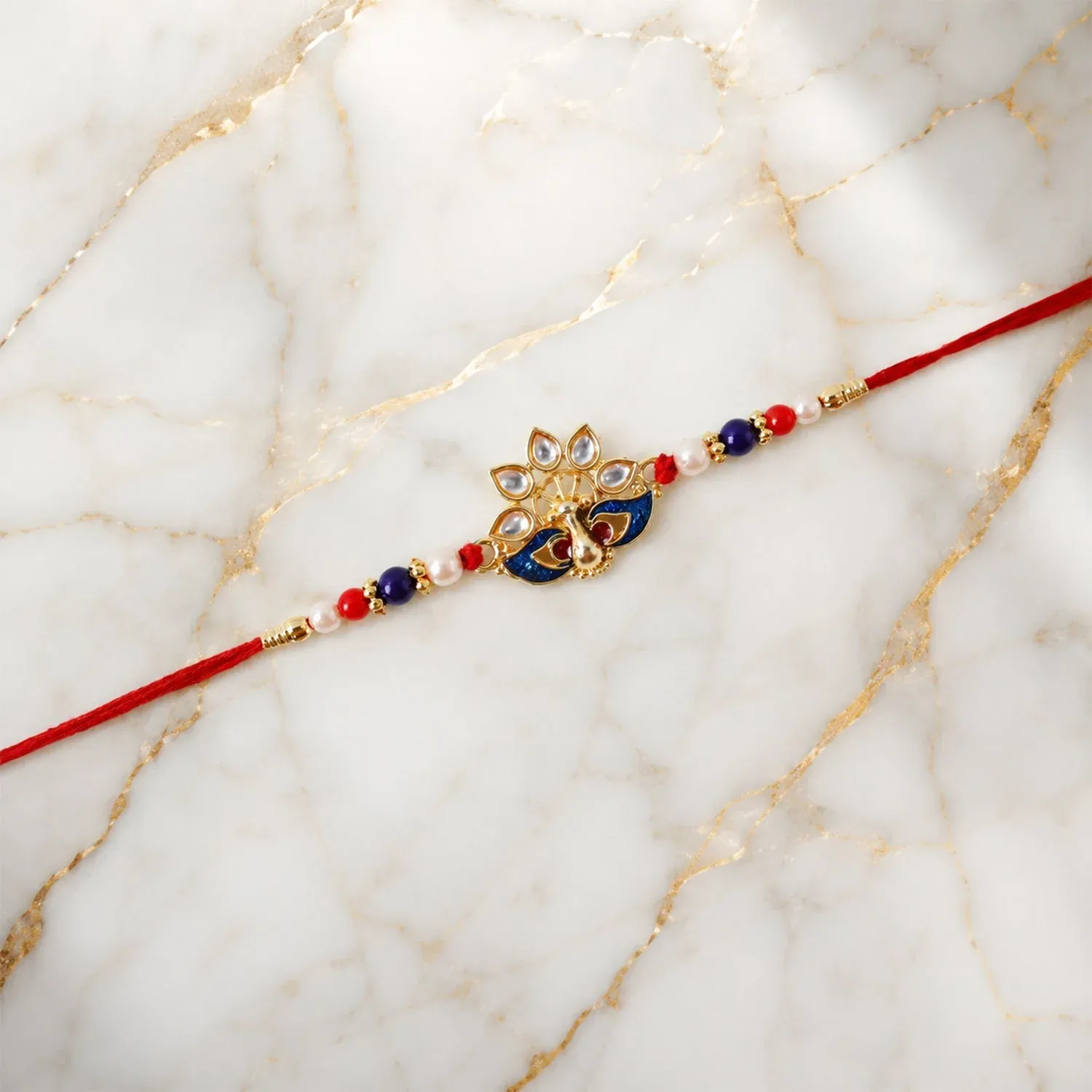 Peacock Rakhi – Elegant Pearl Beads & Bright Red Thread - Detailed Feature View 6