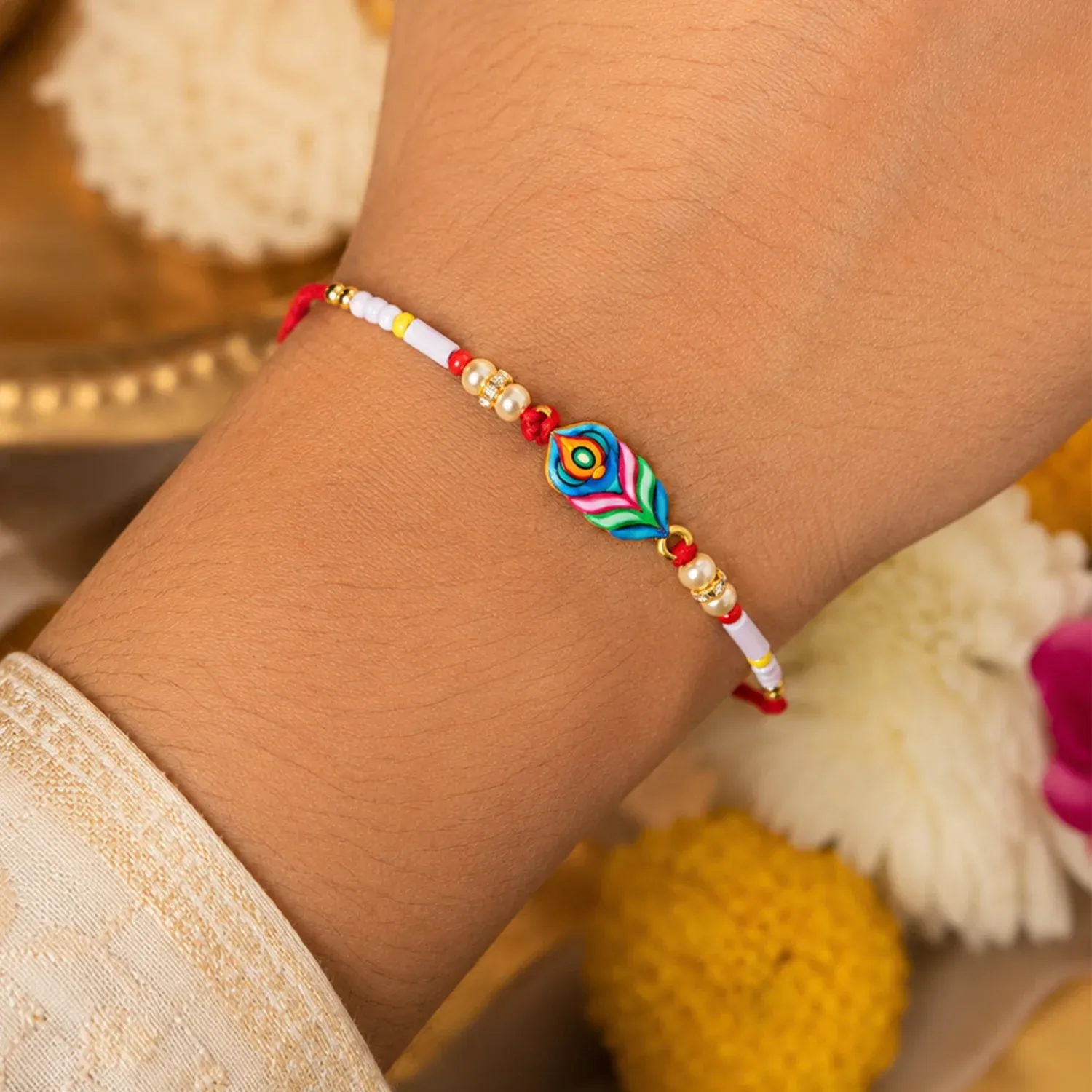 Rakhi – Colorful Beaded Rakhi with Peacock Charm for Brother - Detailed Feature View 1