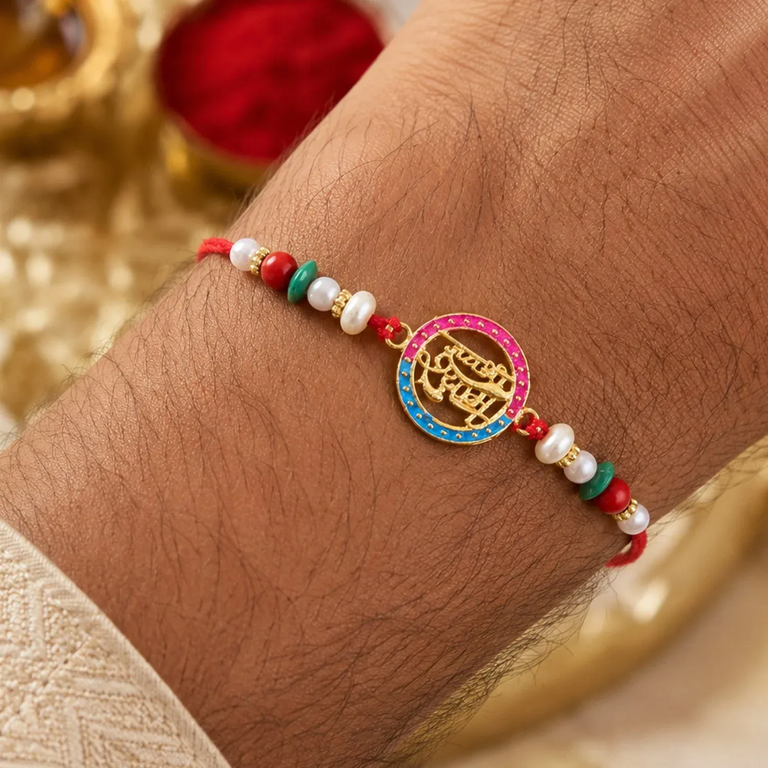 Rakhi – Traditional thread with pearls & divine Hindi text - Detailed Feature View 1