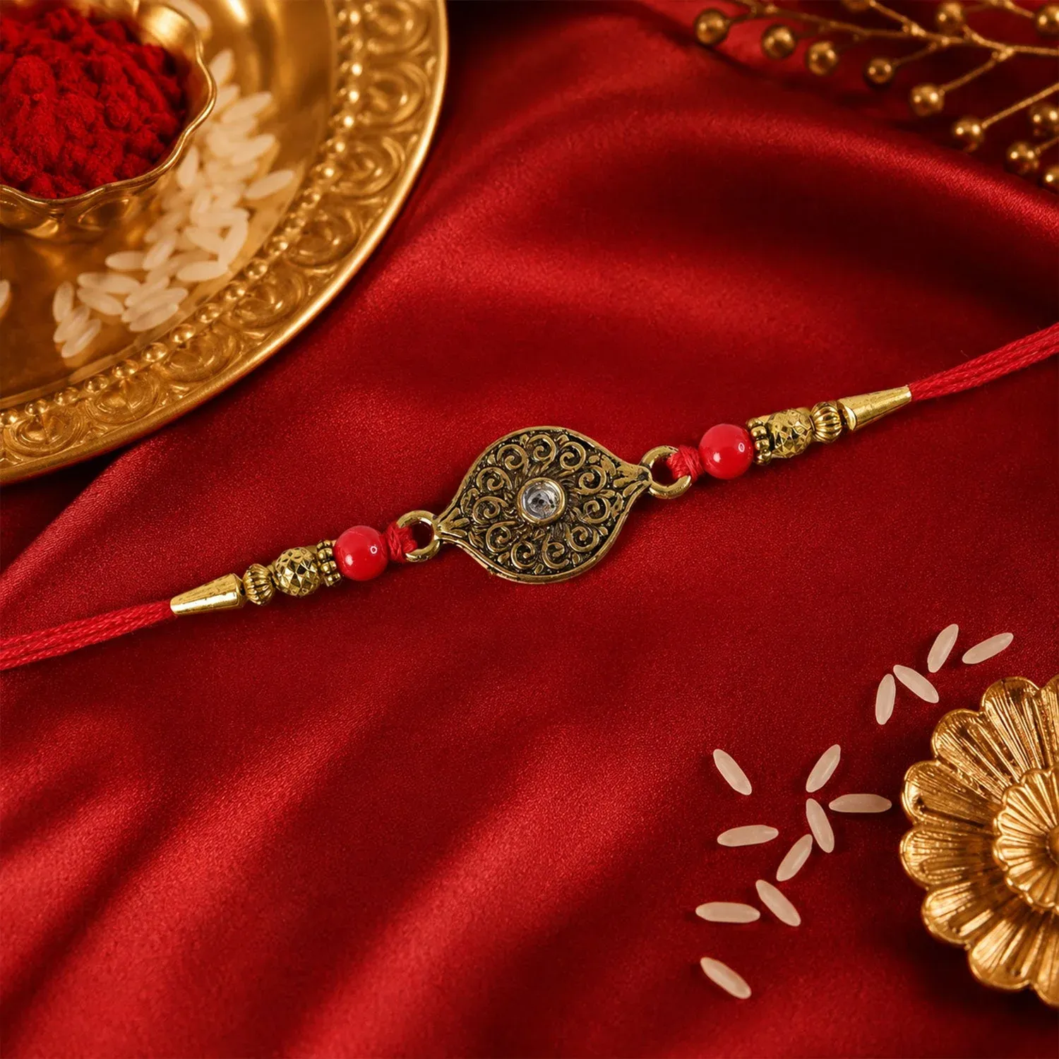 Rakhi – Elegant Antique Oval with Red Crystal Beads for Brothers - Detailed Feature View 2