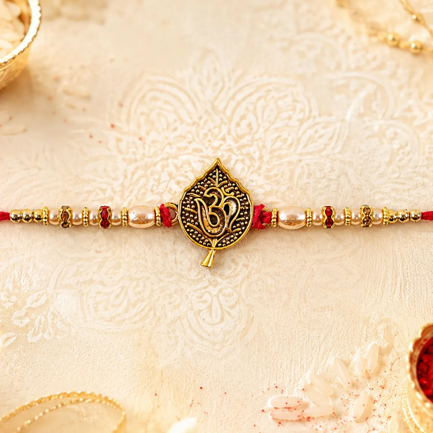 Premium Leaf Shape Om Motif Premium Beaded Designer Rakhi for Brother - Buy Online at Alikart