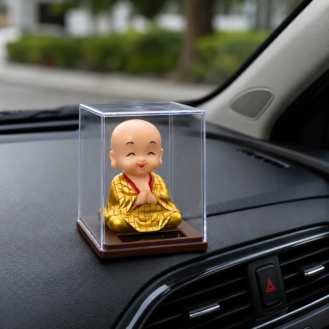 Solar Bobble Head Monk Showpiece in Acrylic Case for Car & Home Decor - Detailed Feature View 1