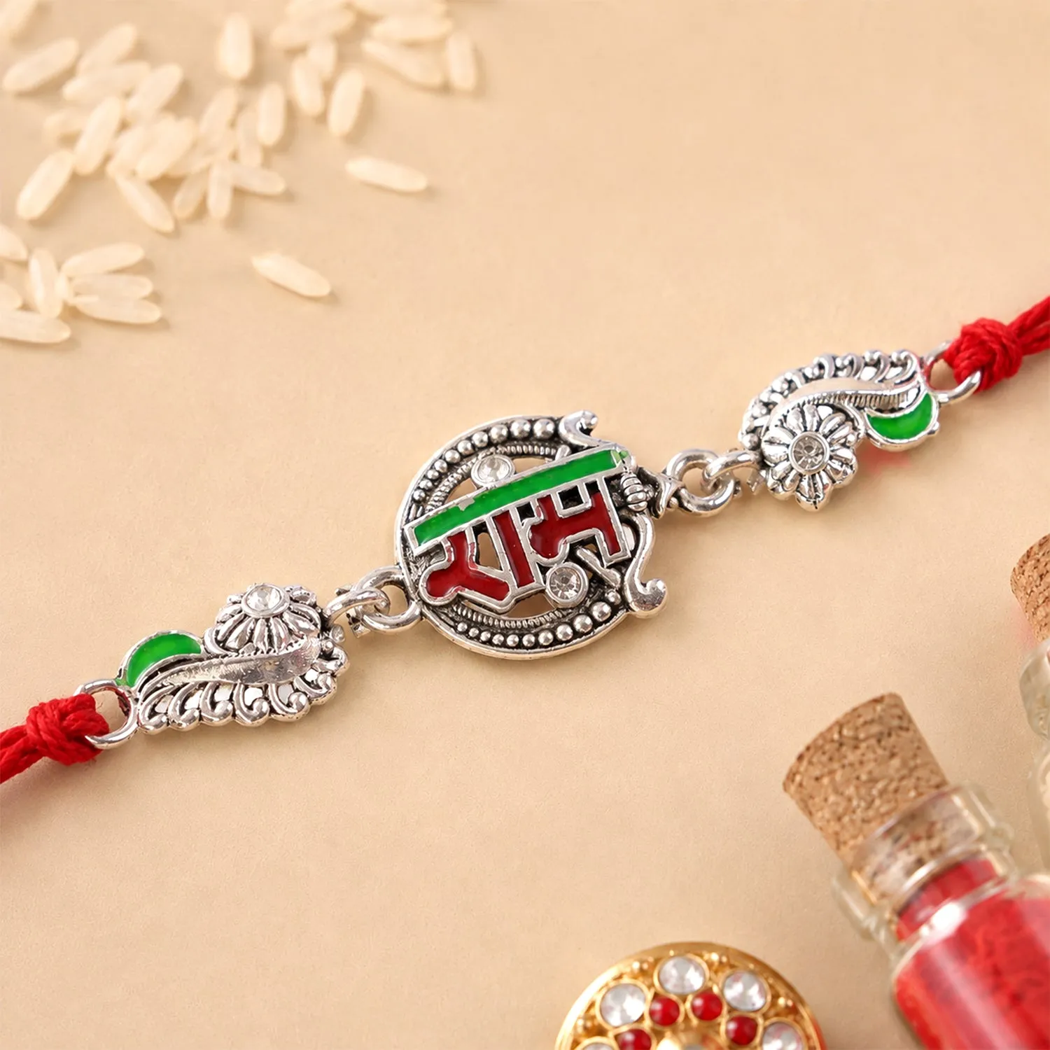 Premium Silver-Toned Ram Rakhi with Red & Green Enamel and Crystal Accents for Brother - Buy Online at Alikart