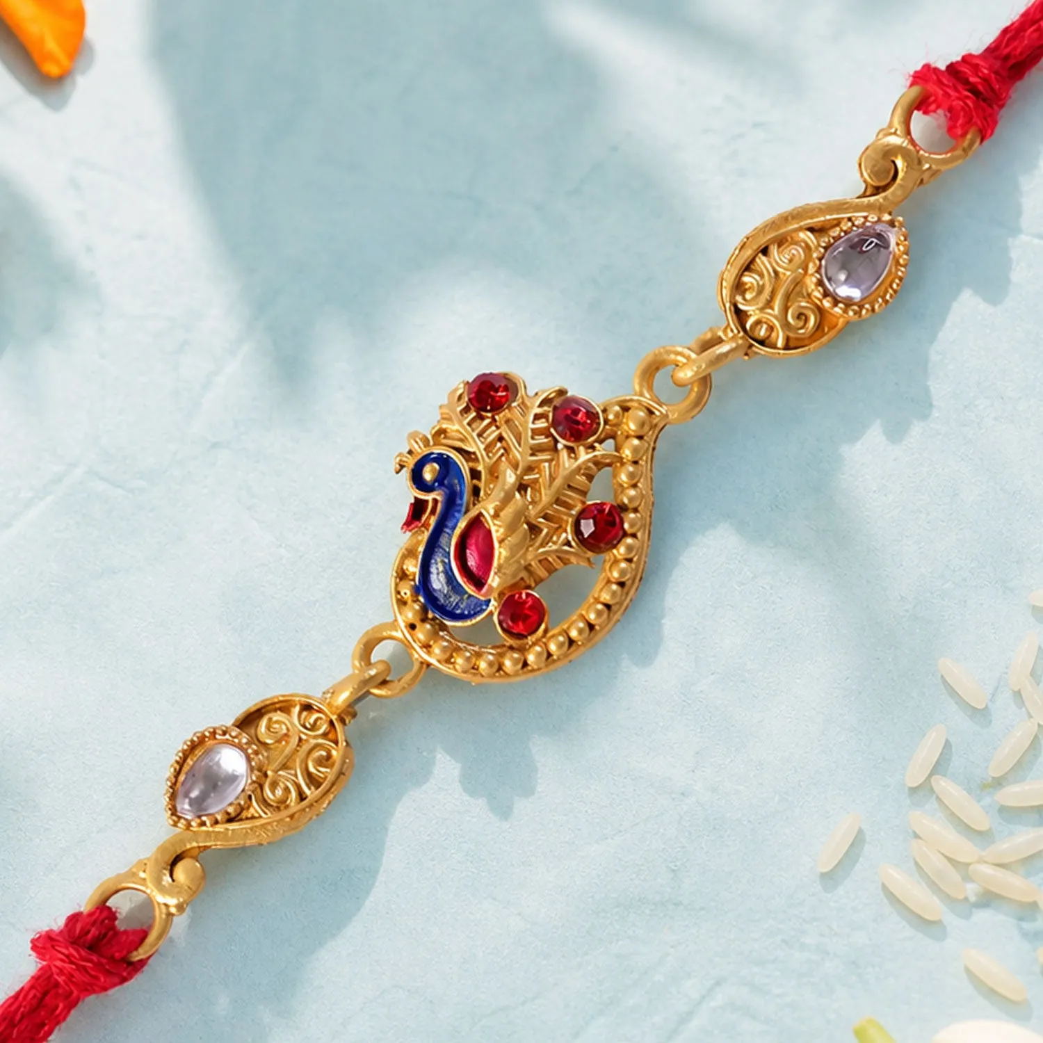 Festive Rakhi featuring Peacock Charm, pink accents and wrist style for Gift Styling - Detailed Feature View 3