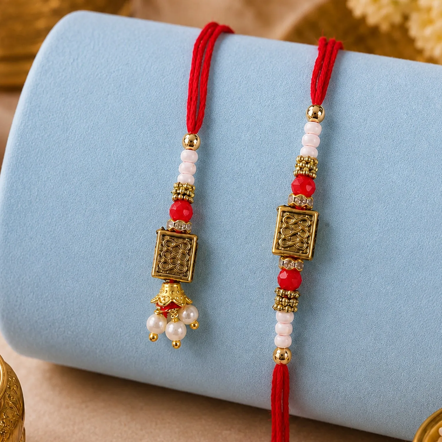 Premium Geometric Rectangle Bhai Bhabhi Rakhi with Rectangular Emblem and Pearls for Gifting - Buy Online at Alikart