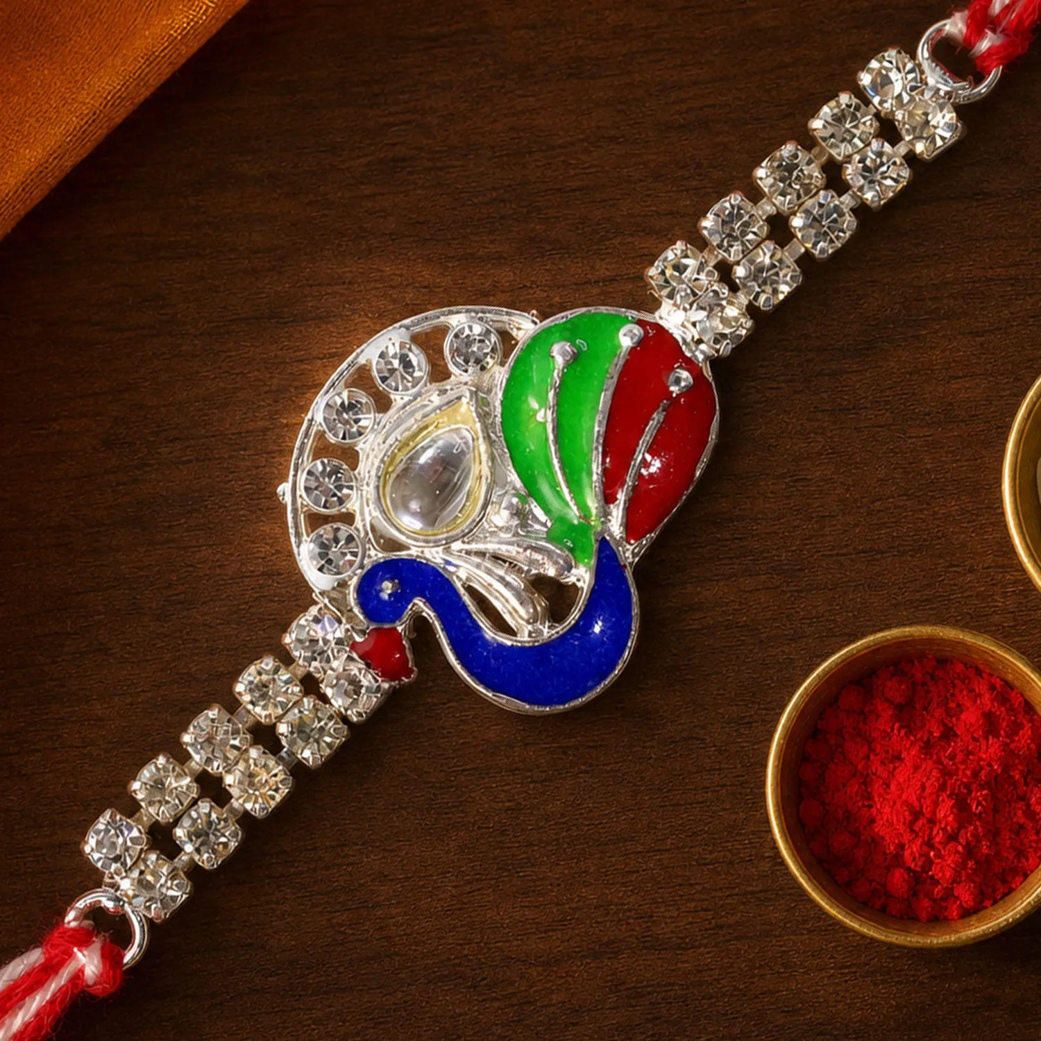 Premium Silver-Toned Peacock Rakhi with Multicolor Enamel, Kundan-Style Stone & Double Crystal Chain - Buy Online at Alikart