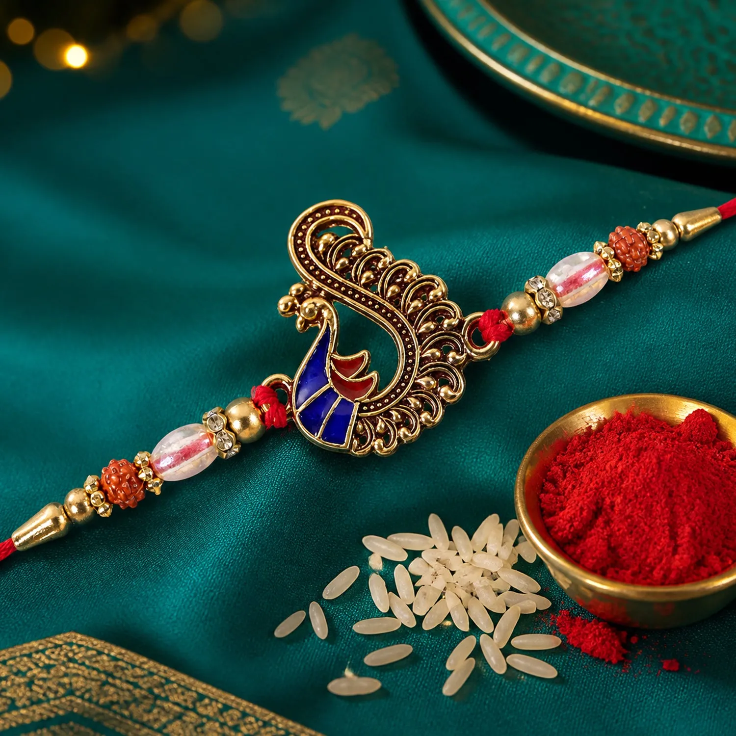 Premium Designer Rakhi with Peacock Paisley Charm, blue stones and thread look for Gift Use - Buy Online at Alikart