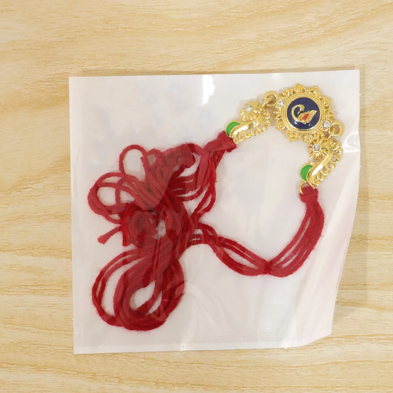 Ornate Rakhi showcasing Blue Oval Medallion, metal trims and chain look for Gift Use - Detailed Feature View 5