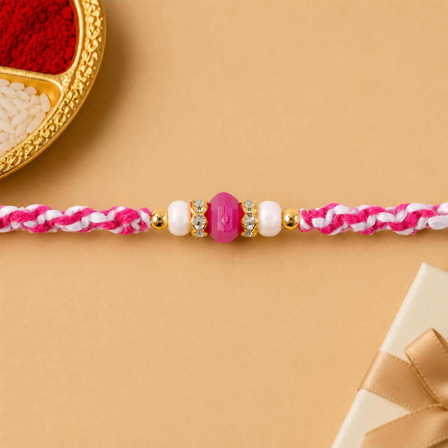 Premium Pink-White Braided Rakhi with Rose-Pink Stone Bead Pendant - Buy Online at Alikart
