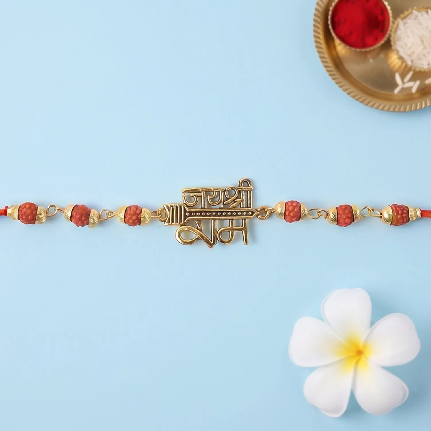 Premium Jai Shree Ram Rudraksha Rakhi – Golden Arrow Pendant for Brothers - Buy Online at Alikart