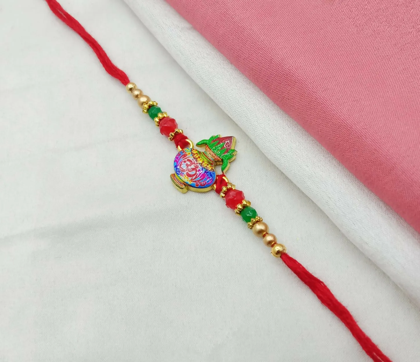 Spiritual Radha Krishna Metallic Rakhi for Brother with Peacock Feather Detail & Rhinestone Accents - Detailed Feature View 4