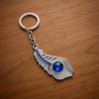 Premium Blue Stone Peacock Feather Keychain with Silver Tone Decorative Design - Buy Online at Alikart