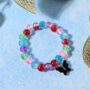 Premium Crackle-Bead Stretch Bracelet – Vibrant Multicolor with Butterfly Charm - Buy Online at Alikart