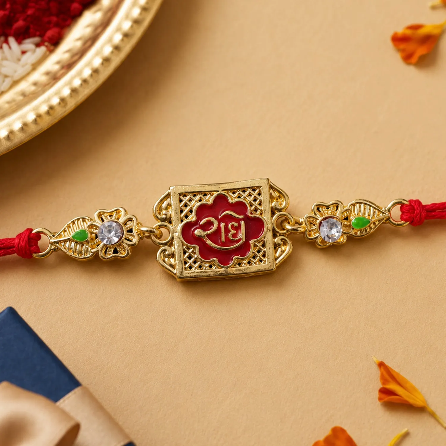 Premium Gold-Toned Radhe with Red Enamel, Crystal Accents & Red Thread - Buy Online at Alikart