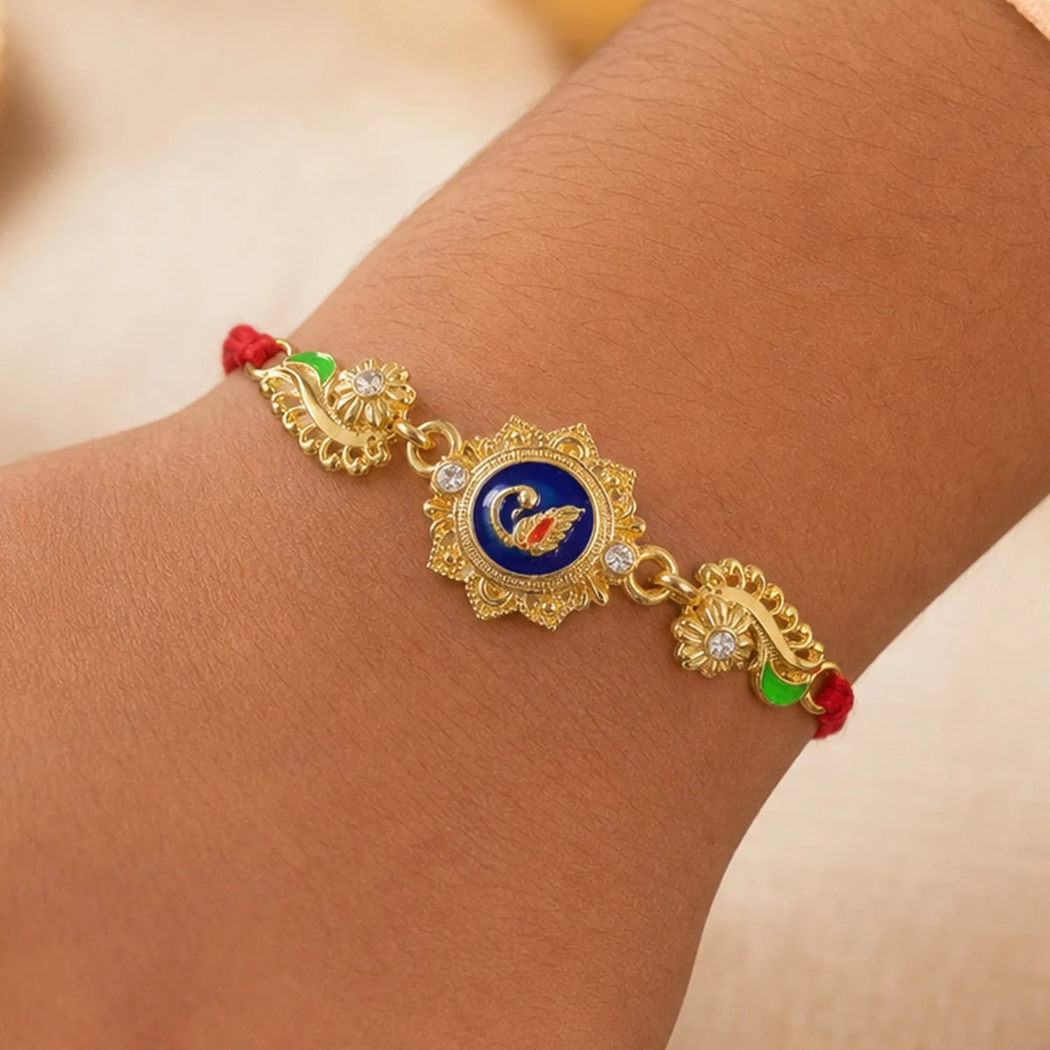 Ornate Rakhi showcasing Blue Oval Medallion, metal trims and chain look for Gift Use - Detailed Feature View 2