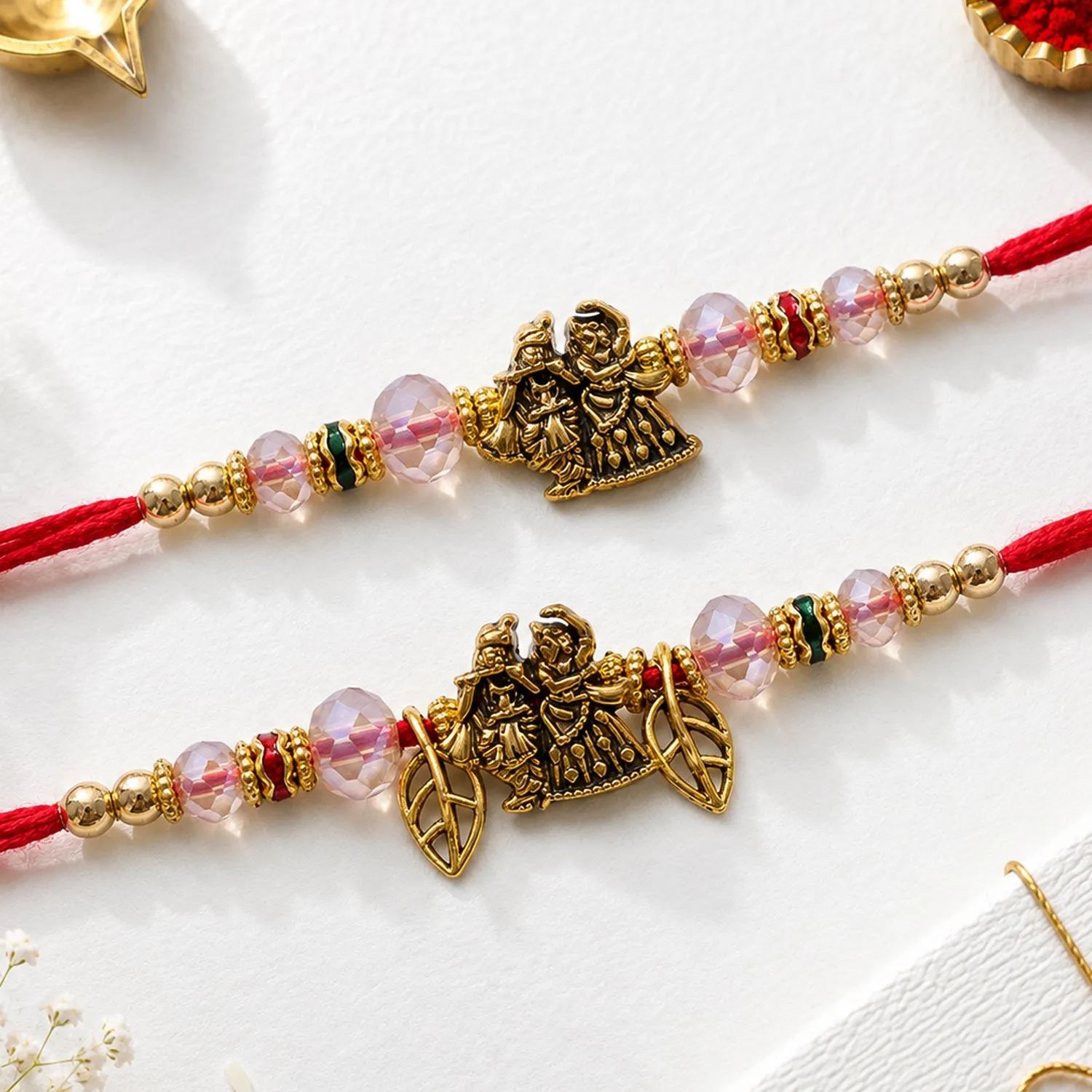 Premium Religious Deity Bhai Bhabhi Rakhi with Radha-Krishna Motif and Leaf Charms for Gift - Buy Online at Alikart
