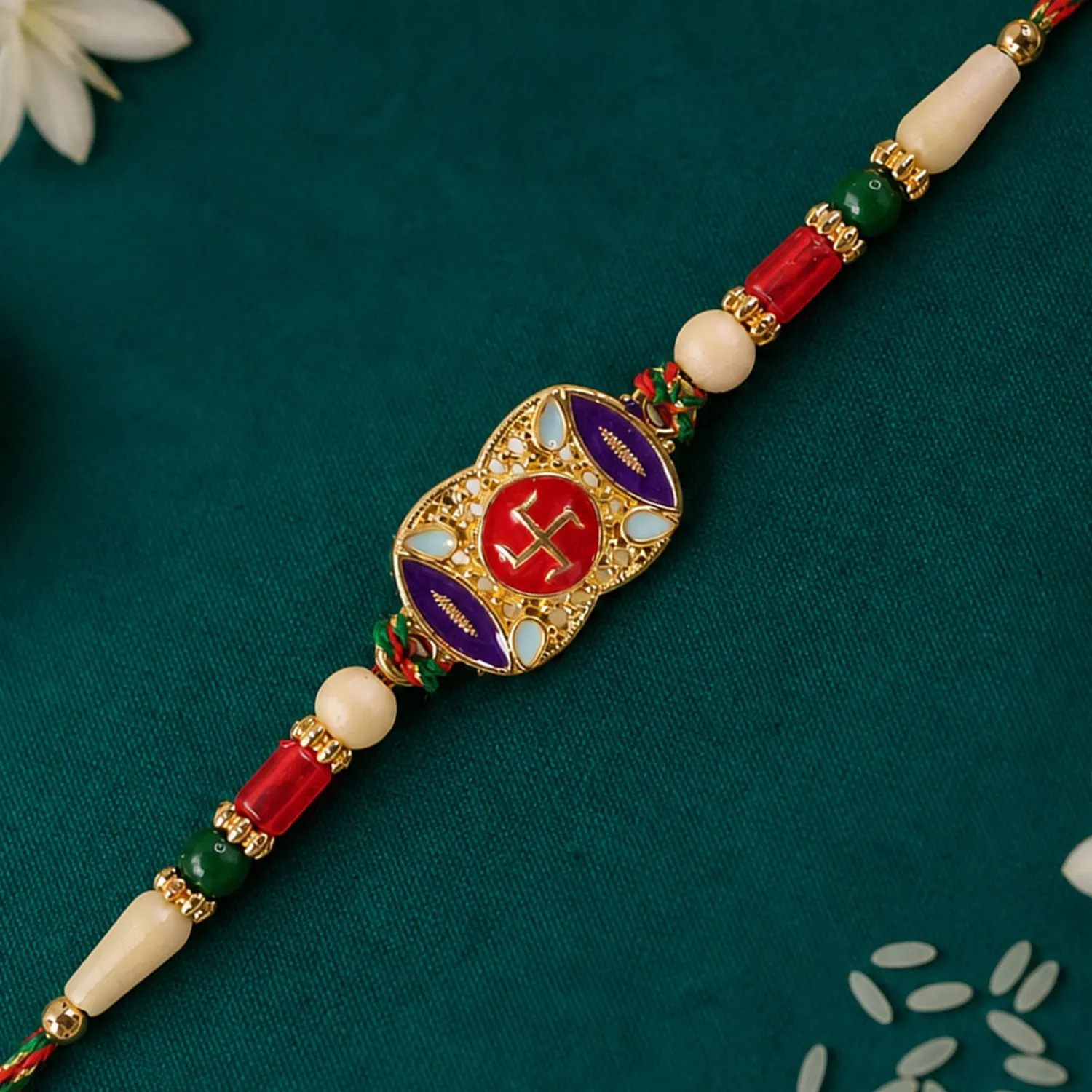 Premium Festive Rakhi featuring Swastik Medallion and gold trims in display look for Gift Use - Buy Online at Alikart