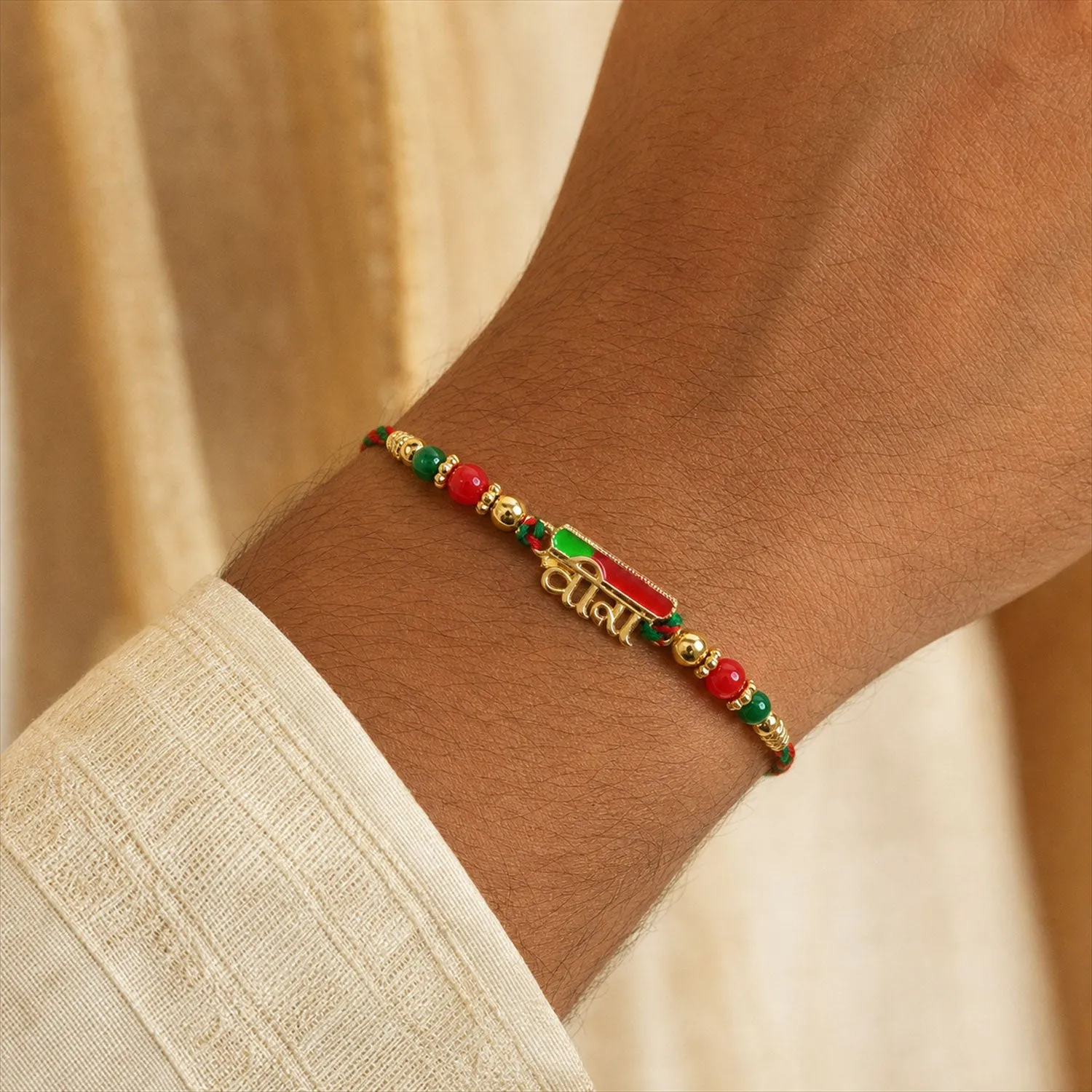 Premium Premium Rakhi showcasing Bhai Text Plaque, clean frame and wrist look for Gift Use - Buy Online at Alikart