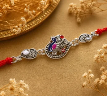 Silver-Toned Peacock Rakhi with Pink-Blue Enamel, Crystal Accents & Red Thread for Brother