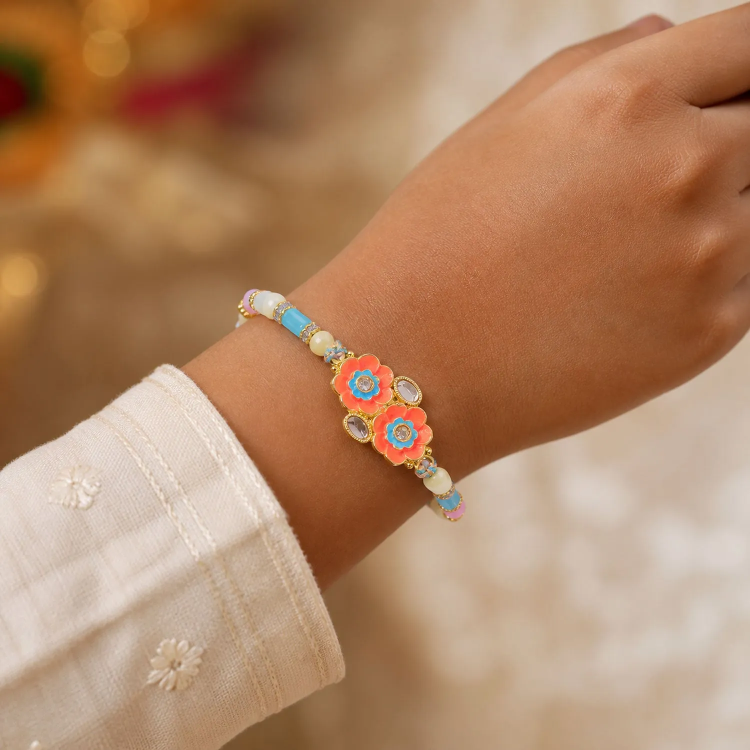 Premium Ornate Rakhi with Butterfly Bloom Charm, multicolor stones and bead line for Gift Use - Buy Online at Alikart