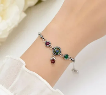 Antique Silver Adjustable Bracelet featuring Peacock Eye Cabochon, Maroon & Green Side Stones, & Bead Dangles