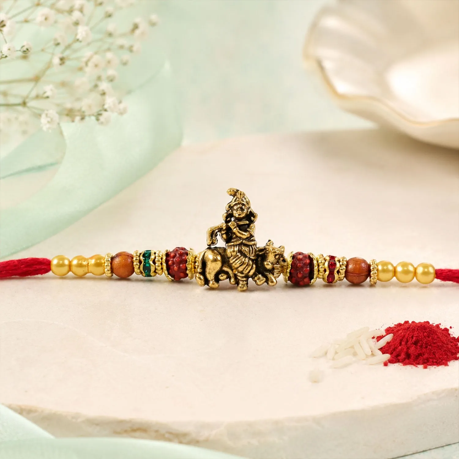 Bal Krishna Rakhi – Golden Idol Centre & Pearl Accents - Detailed Feature View 2