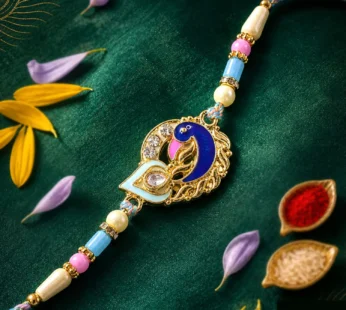 Festive Rakhi featuring Peacock Charm, blue stones and wrist style for Raksha Bandhan