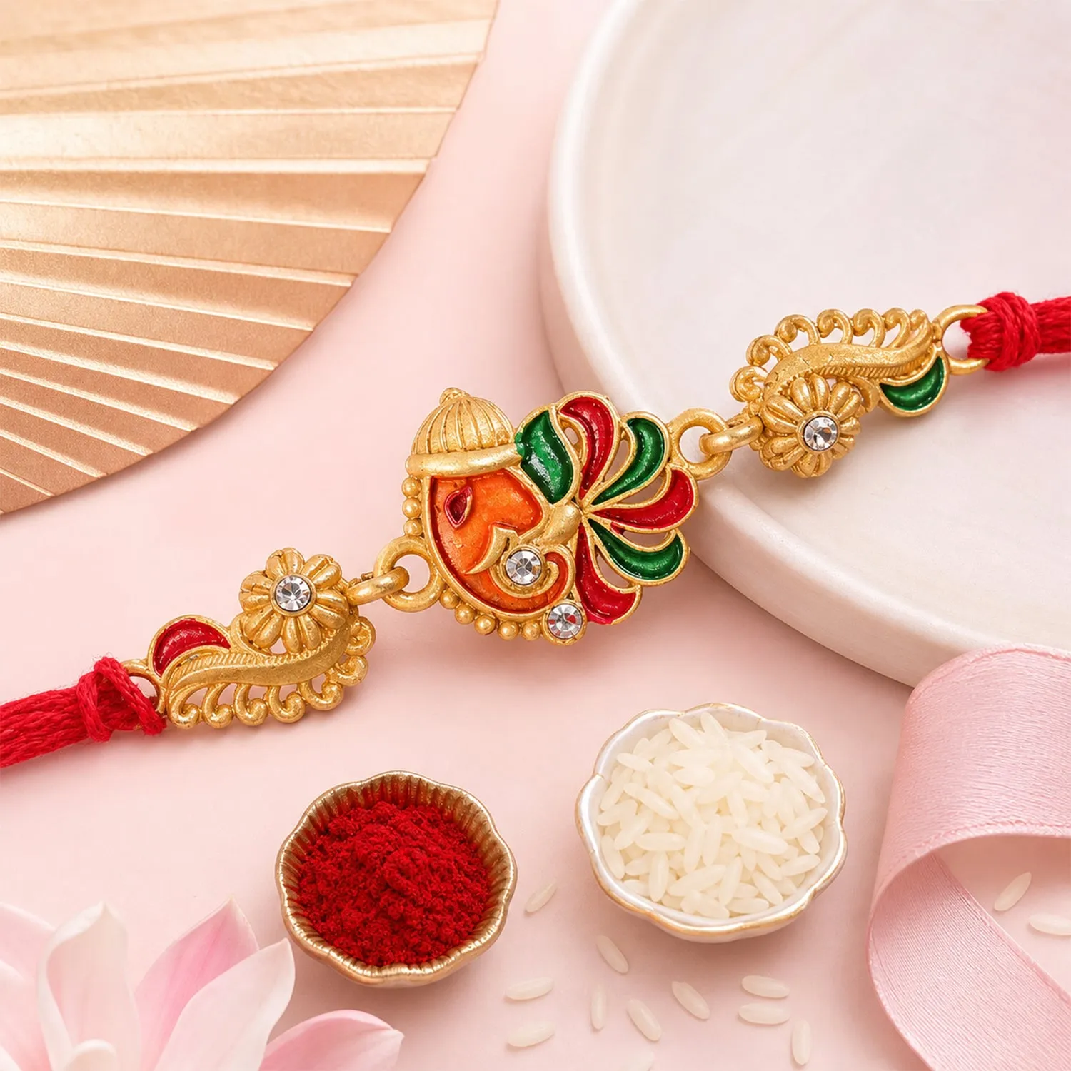 Premium Gold-Toned Lord Ganesha Rakhi with Multicolor Enamel, Crystal Accents & Designer Red Thread - Buy Online at Alikart