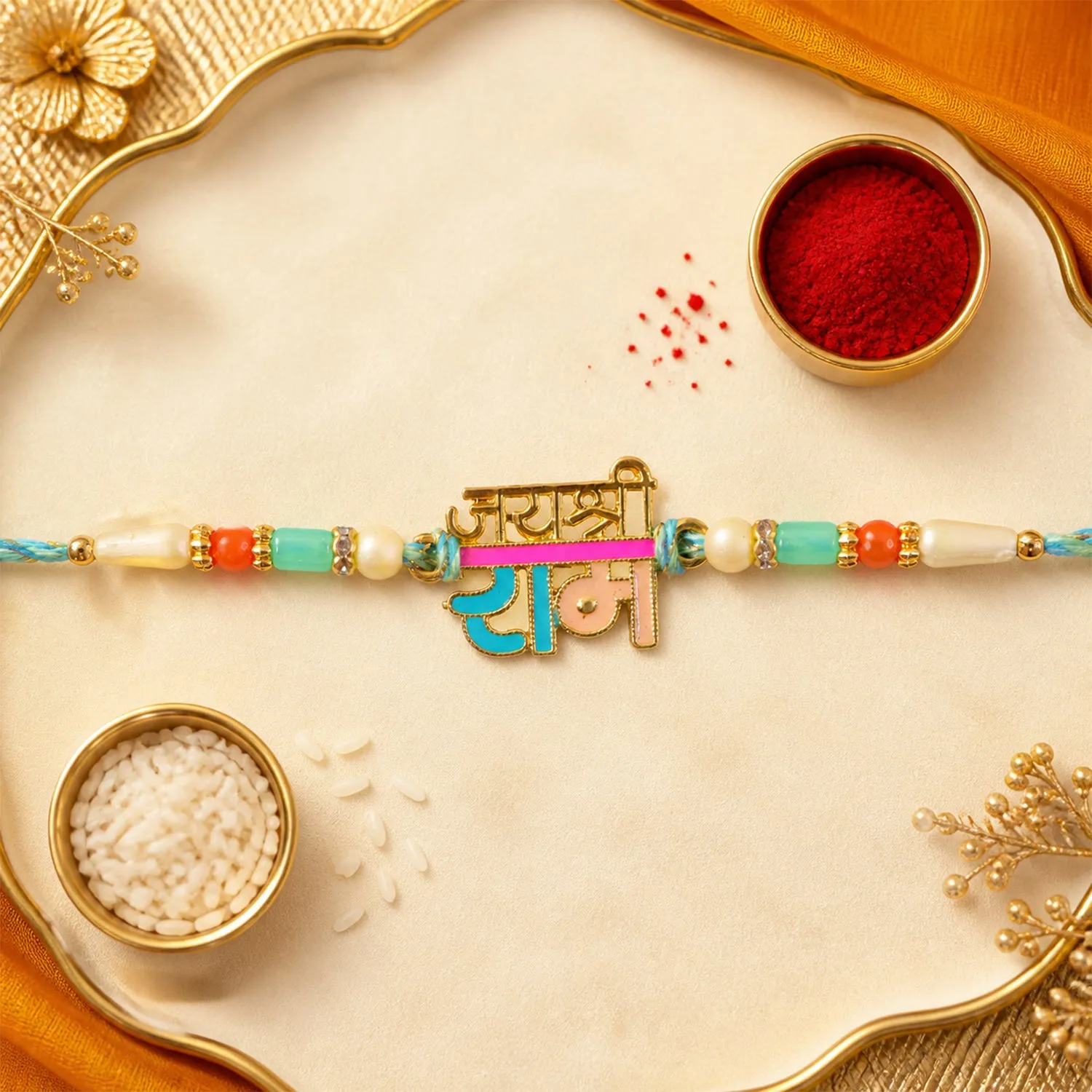 Premium Premium Rakhi showcasing Jai Shri Ram Plaque, gold trims and chain look for Gift Use - Buy Online at Alikart