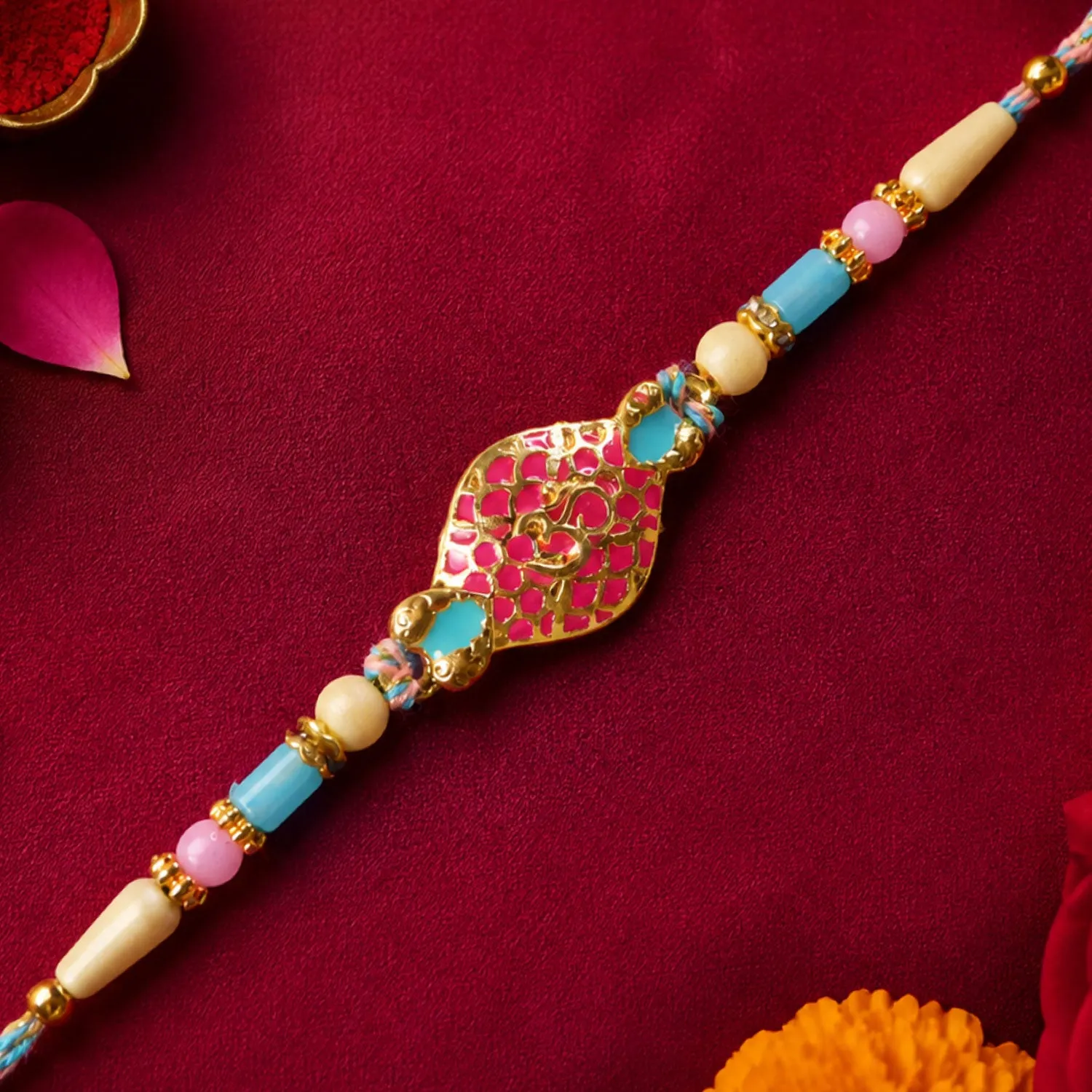 Festive Rakhi with Paisley Heart Charm, blue stones and wrist style for Gift Use - Detailed Feature View 1