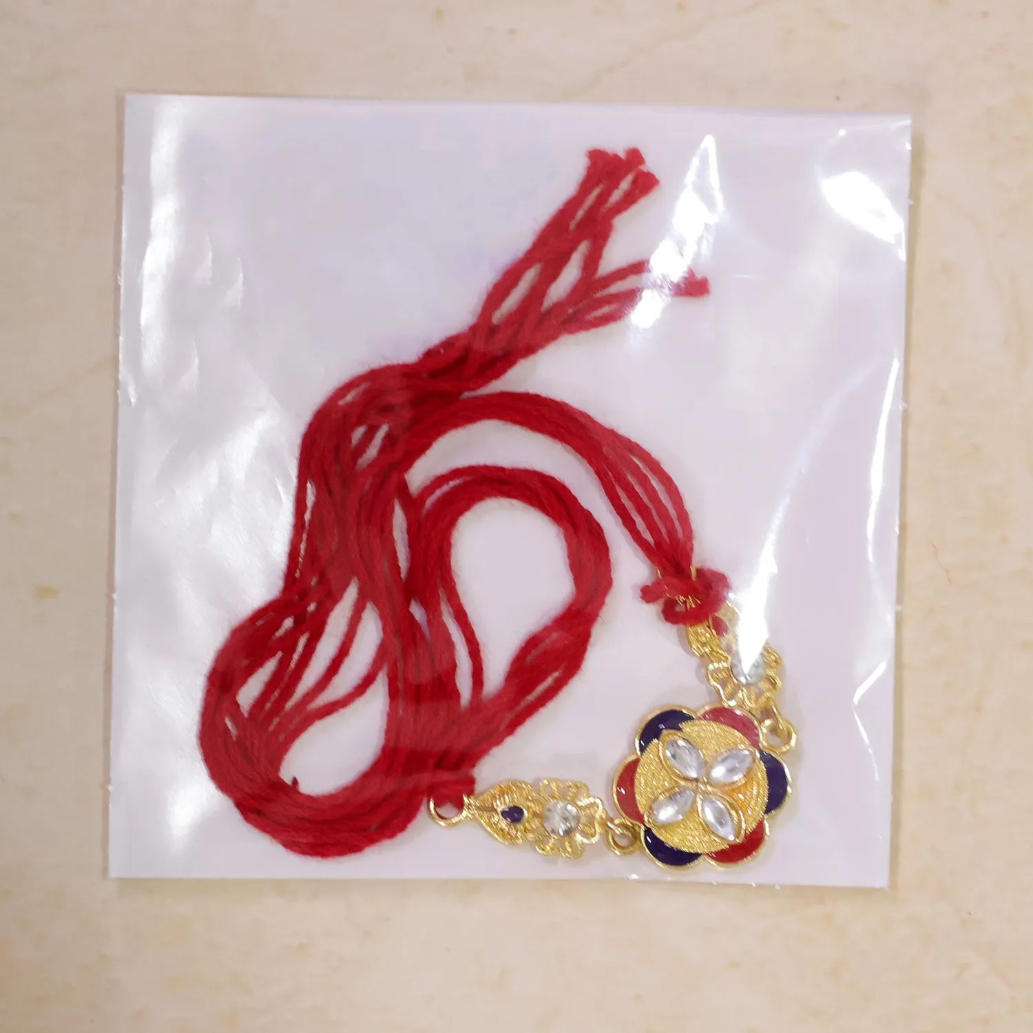 Festive Rakhi showcasing Decorative Rosette, pearl accents and bead line for Gifting - Detailed Feature View 5