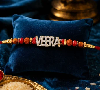 Veera Name Rakhi – Golden Designer with Red Stones & Pearls
