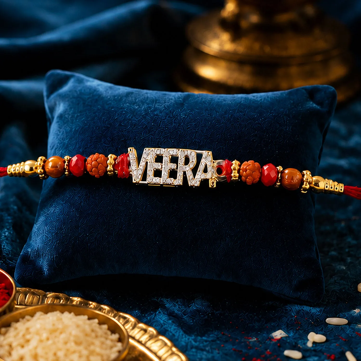 Premium Veera Name Rakhi – Golden Designer with Red Stones & Pearls - Buy Online at Alikart
