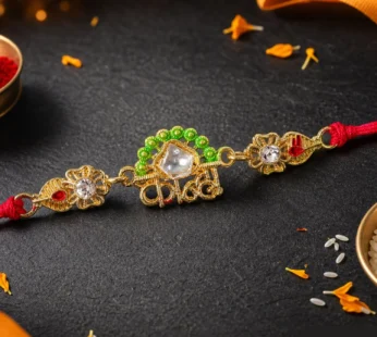 Gold-Toned Kanha Rakhi with Kundan-Style Stone, Green Enamel, Crystal Accents & Red Thread