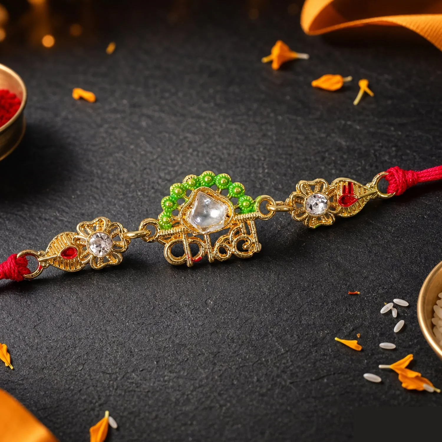 Premium Gold-Toned Kanha Rakhi with Kundan-Style Stone, Green Enamel, Crystal Accents & Red Thread - Buy Online at Alikart