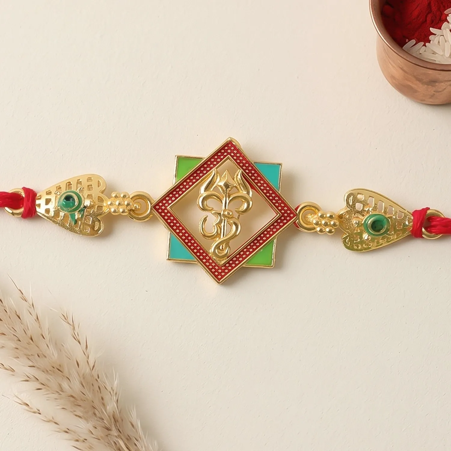 Premium Gold-Toned Om Trishul Rakhi with Colorful Enamel for Raksha Bandhan - Buy Online at Alikart