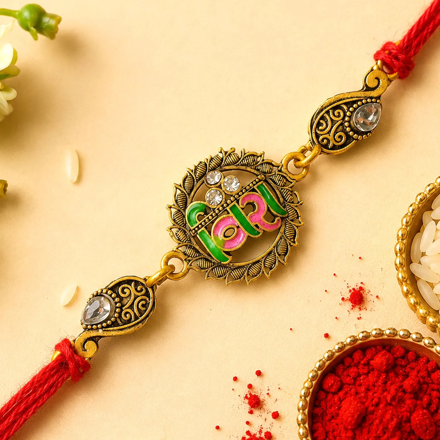 Premium Antique Gold-Toned Veera Rakhi with Pink-Green Enamel, Crystal Accents & Red Thread - Buy Online at Alikart