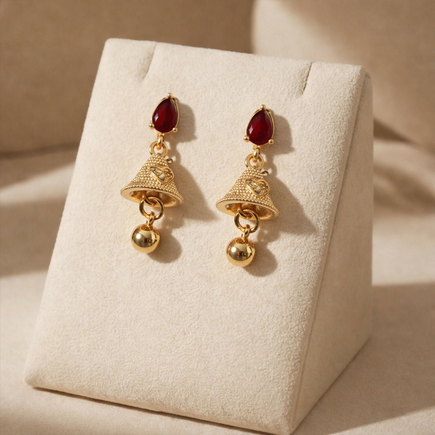 Premium Exquisite Ruby Teardrop Jhumka Earrings with Textured Gold Bell Accents - Buy Online at Alikart